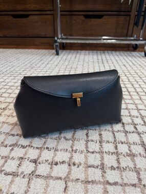 TOTEME t Lock convertible clutch with strap